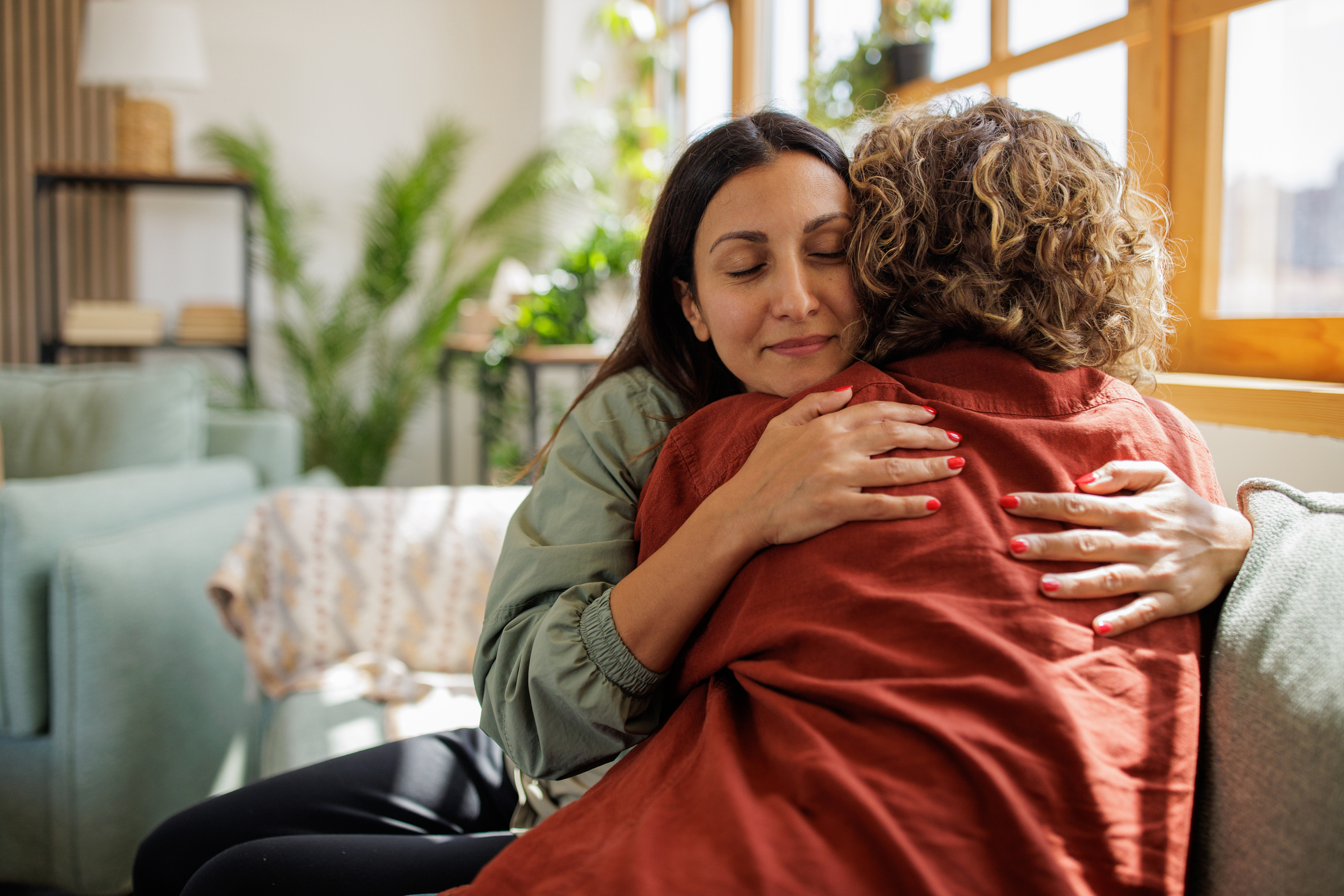 Two women embracing in a supportive moment